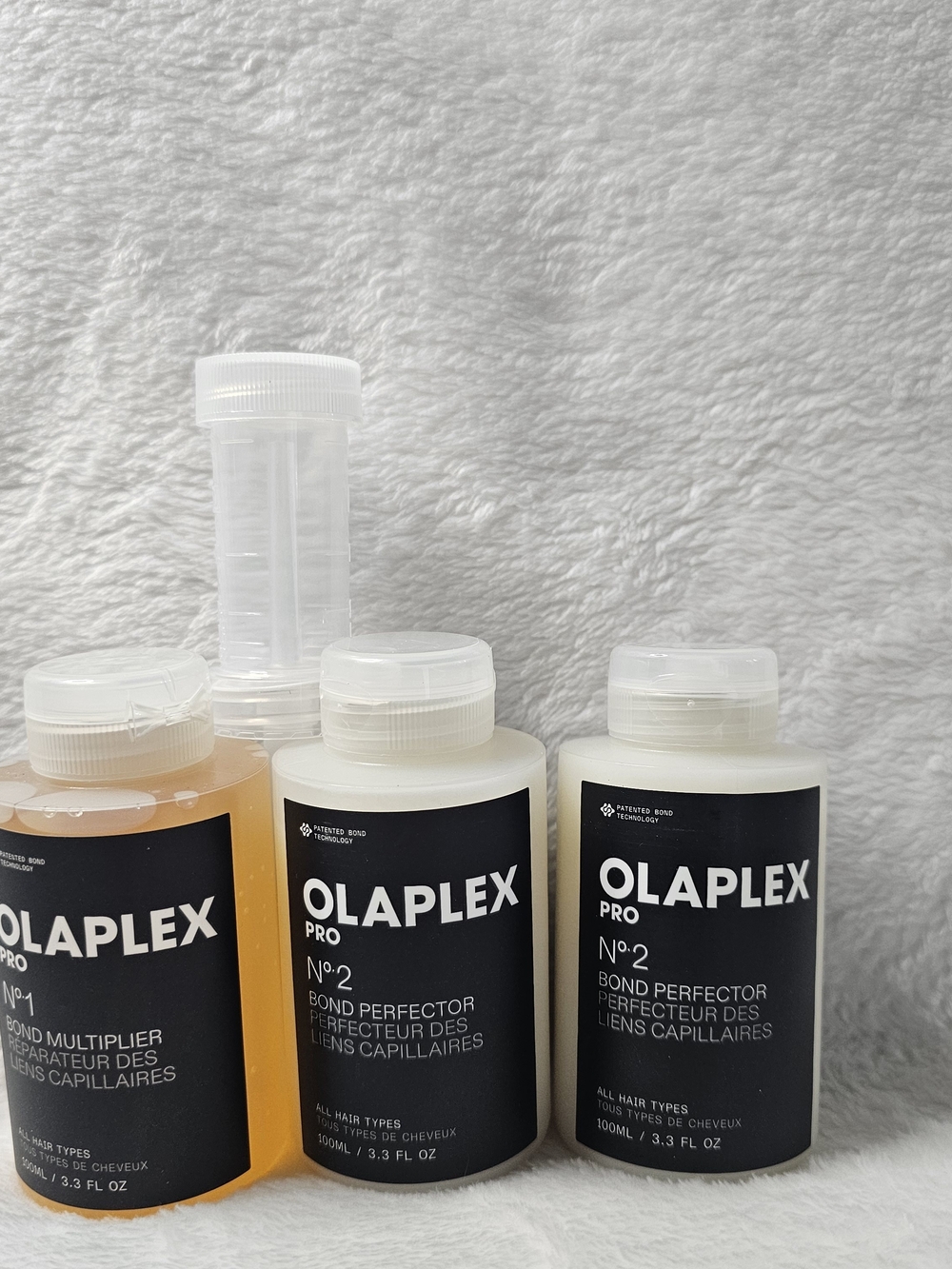 OLAPLEX Pro No.2 Bond Perfector - White and Amber Accents